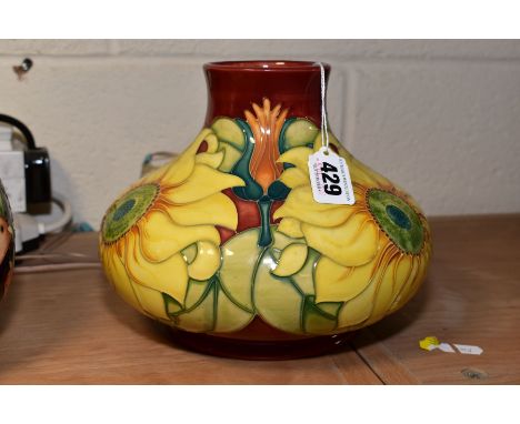 A MOORCROFT POTTERY SQUAT BALUSTER VASE IN THE INCA PATTERN, on a red ground, circa 1994, impressed and painted marks, height