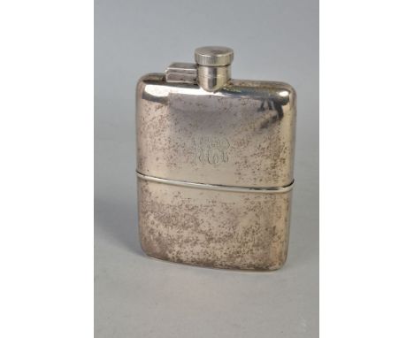 A GEORGE V SILVER HIP FLASK, of rectangular form, bayonet fitting hinged cover, engraved initials to the flask, pull off slee