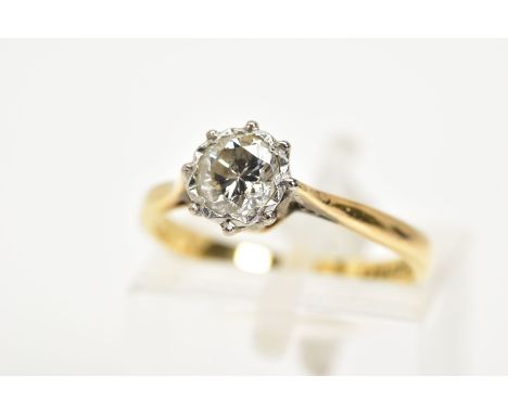 A SINGLE STONE DIAMOND RING, the yellow metal ring set with a single round brilliant cut diamond, colour assessed as L/M, cla