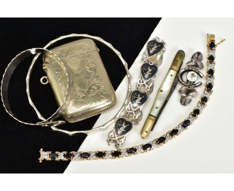 A SELECTION OF ITEMS, to include a gold plated line bracelet set with sixteen oval cut sapphires, interspaced with crossover 