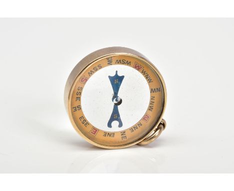 A VICTORIAN YELLOW METAL COMPASS FOB, of circular design, glass panels, blue hands, yellow metal surround stamped 15ct, with 