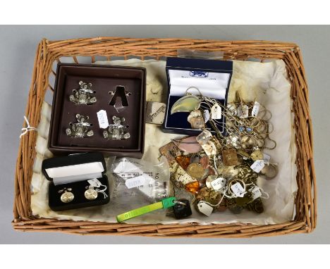 A WICKER BASKET OF JEWELLERY AND ITEMS, to include ten white metal necklaces such as leaf design panel set with labradorite, 