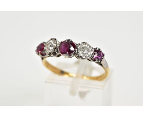 A YELLOW METAL RUBY AND DIAMOND FIVE STONE RING, designed with three circular cut rubies, interspaced with two old cut diamon