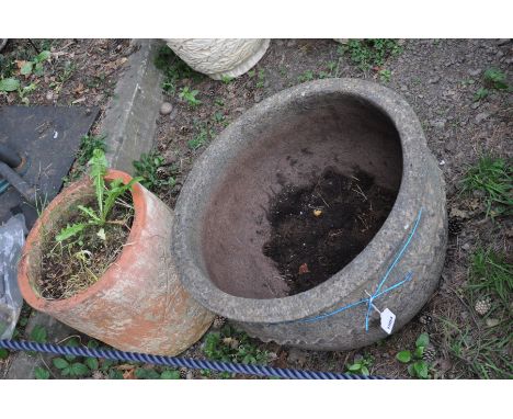 A LARGE COMPOSITE PLANT POT with detail to body, 58cm in diameter x 39cm high and a terracotta planter with floral detail to 