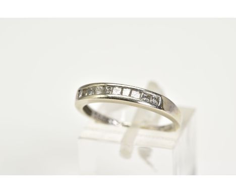 A 9CT WHITE GOLD DIAMOND HALF HOOP RING, set with ten princess cut diamonds in a rub over setting, hallmarked 9ct gold London