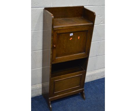 AN EARLY TO MID 20TH CENTURY OAK SINGLE DOOR GENTLEMANS CUPBOARD, the panel door revealing an assortment of open shelves, sin