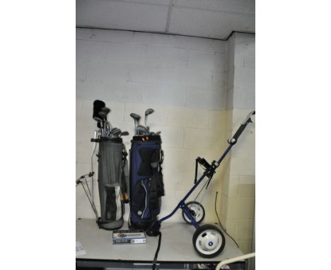 TWO GOLF BAGS WITH CLUBS AND A SABRE GOLF TROLLEY, clubs include Dunlop, Howson, Wilson Donnay etc