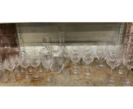 SHELF OF CUT GLASS WINE GLASSES, GOBLETS, WATER JUG, DECANTERS ETC