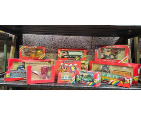 SHELF OF 12 BOXED BRITAIN'S FARM VEHICLES ETC