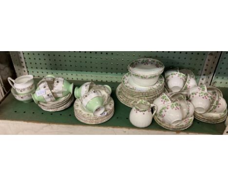 SHELF OF 2 DIFFERENT PATTERNED CHINAWARE