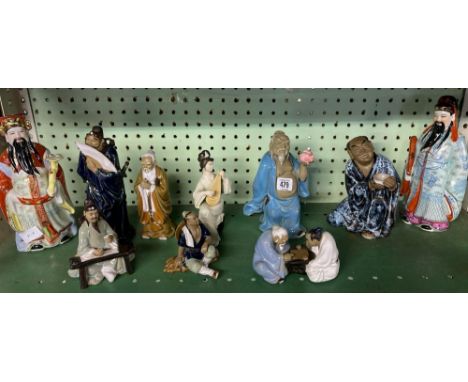 SHELF OF ORIENTAL FIGURES