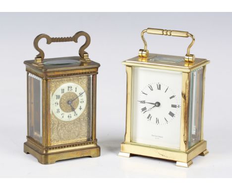 A late 19th century French brass carriage timepiece with eight day movement, the cream chapter ring with black Arabic hour nu