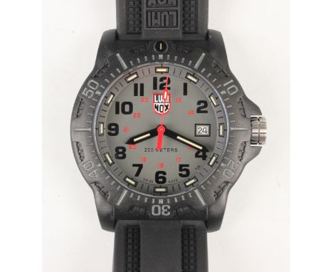 A Luminox black carbon compound cased diver's wristwatch with quartz movement, the signed grey dial with black Arabic hour nu
