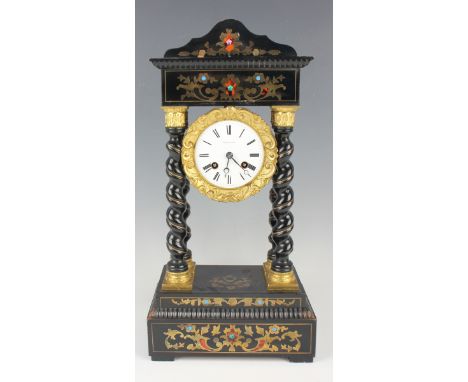 A 19th century French ebonized and gilt metal mounted portico mantel clock with eight day movement striking on a bell via an 