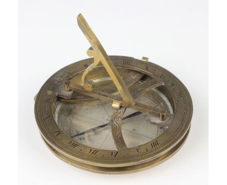 A 19th century brass equinoctial pocket sundial, the brass circular base with glazed silvered compass rose and blued steel po