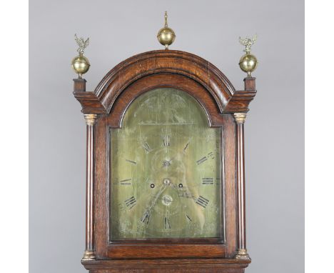 A George III oak longcase clock with eight day movement striking on a bell, the 12-inch brass breakarch dial with engraved ea