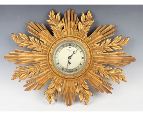 A mid-20th century giltwood sunburst wall timepiece, the silvered dial inscribed 'Garrard &amp; Co Ltd... an Elliott Clock', 