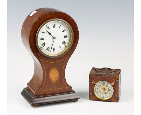 An Edwardian mahogany balloon cased mantel timepiece with eight day movement, the circular enamelled dial with black Roman ho