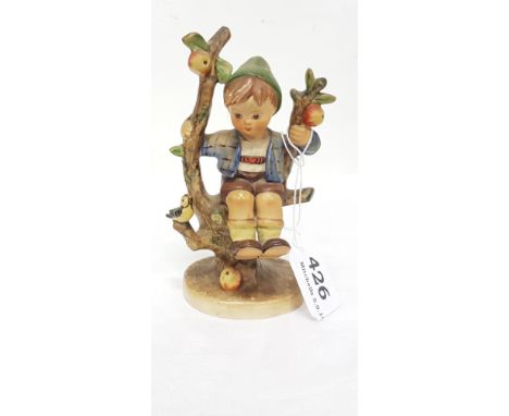 Goebel (Western Germany) figurine of a boy seated on a tree stump, stamped T42, 6"h