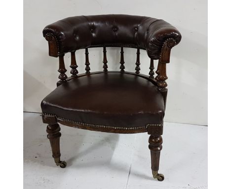 WMIV Oak Framed Library Armchair, the brown leatherette and button detail bow-shaped chair back over turned back rails and an