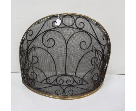 Brass framed spark guard, overlaid with iron fretwork and with grate mounts, 23”w x 20”h