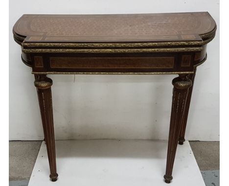 19th C French folding top Card table with parquetry decoration and ormolu edging 88cms wide, 44cms deep, 72cms high
