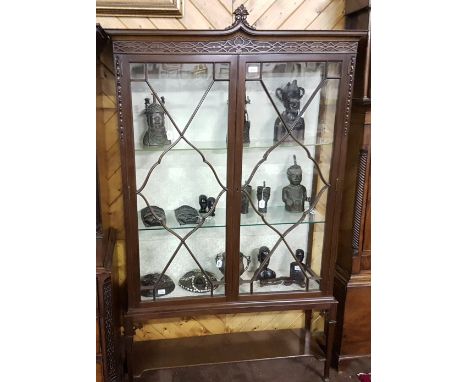 Edwardian Mahogany Display Cabinet, a decorative pediment over two glazed doors enclosing 2 plate glass shelves, tapered legs