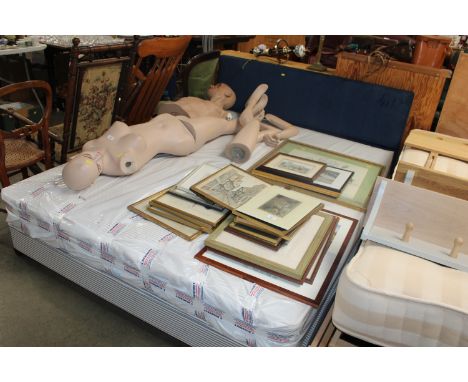 A modern double bed and mattress with blue headboard