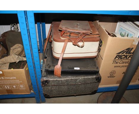 Three luggage cases and a briefcase