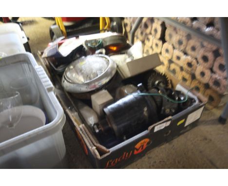 A box containing a quantity of automotive parts to include headlamp, indicators, etc.