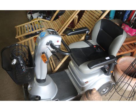 A Quin Go Classic mobility scooter with front basket, charger, indicators and brake lights (key with auctioneer - sold as see