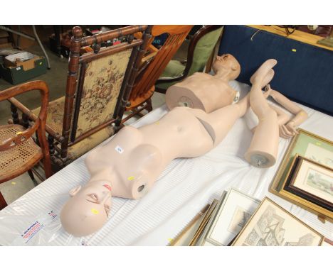 A female mannequin and a part male mannequin