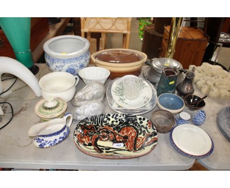 A slipware plate, various jelly moulds, kitchenalia etc