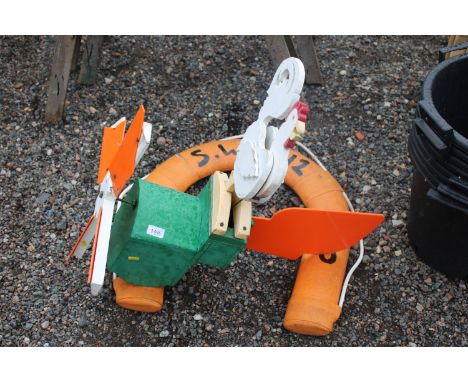 A garden weather vane and a buoyancy aid 