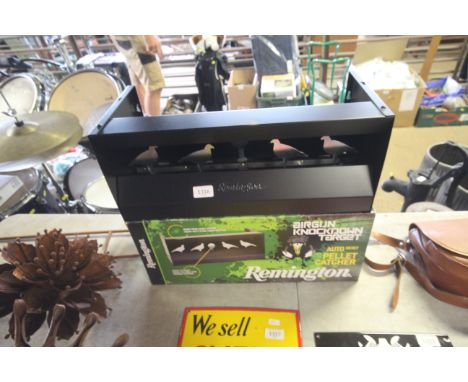 A Remington air gun knock down target with auto reset and original box