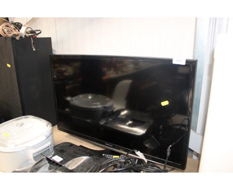 A Samsung TV with remote control