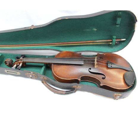 A French violin, with a two piece back and ebonised stringing, bears a label "Antonius Stradivarius cremona faciat anno 1690"