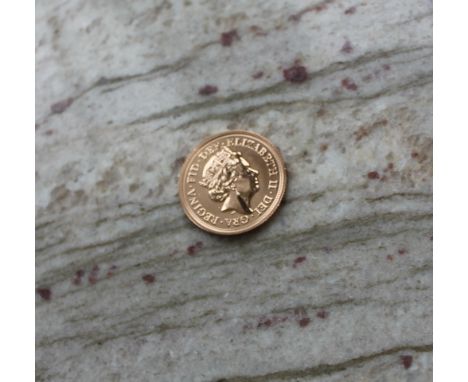 An Elizabeth II gold sovereign dated 2017, this coin signifies the 200th anniversary of the modern sovereign and features a s