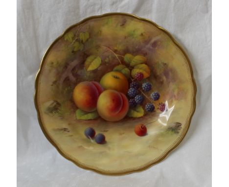A Royal Worcester porcelain dished plate of circular ogee form, painted with still life of peaches, blackberries and foliage,