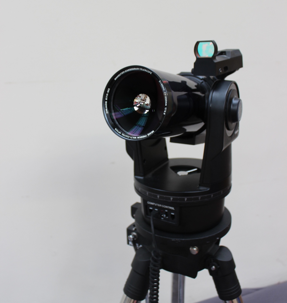 A Meade ETX90 digital telescope, with additional lenses, carry case