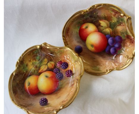 A pair of Royal Worcester porcelain lobed dishes painted with apples, grapes and blackberries to a naturalistic ground signed