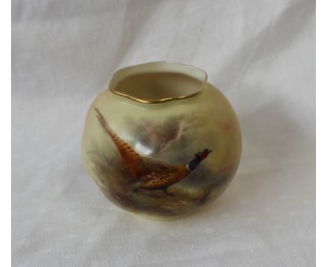 A Royal Worcester porcelain squat vase decorated with a pheasant in the undergrowth, signed Jas Stinton, Green mark, 8cm diam