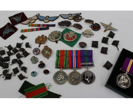 Two World War II medals including The Defence medal and The War medals together with a replica Palestine medal inscribed '357