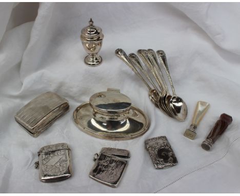 A George V silver inkwell, of oval form, with a recessed edge, Birmingham, 1929, together with three vesta cases, snuff box, 