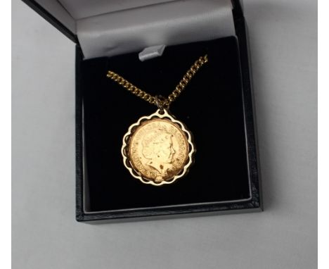 An Elizabeth II gold sovereign dated 2001, in a 9ct gold mount on a 9ct chain, overall weight approximately 21 grams