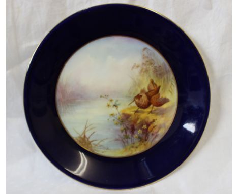 A Royal Worcester porcelain plate, transfer and infil decorated with woodcock, titled 'Ruff', to a blue border printed signat