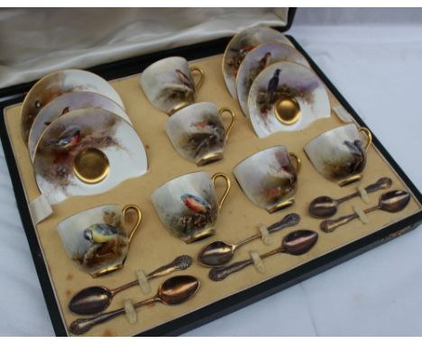 A Royal Worcester green leather cased coffee set, painted with garden birds including Great Tit, Jay, Wren, Bullfinch, Starli