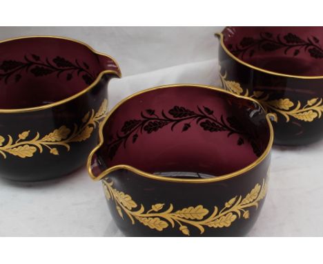 A set of three 19th century amethyst glass and gilt highlighted glass coolers, decorated with oak leaves and acorns, 12cm dia