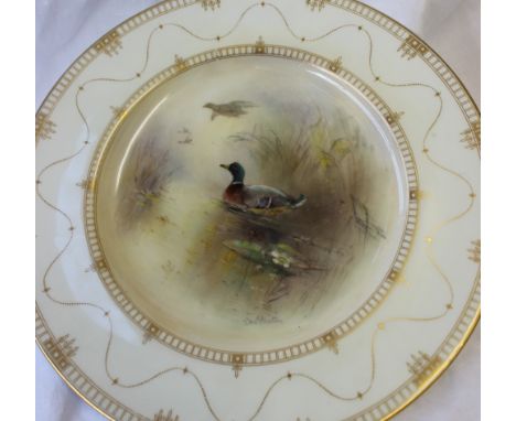 A Royal Worcester porcelain plate transfer and infil decorated to the centre with wild ducks, the cream edge highlighted in g