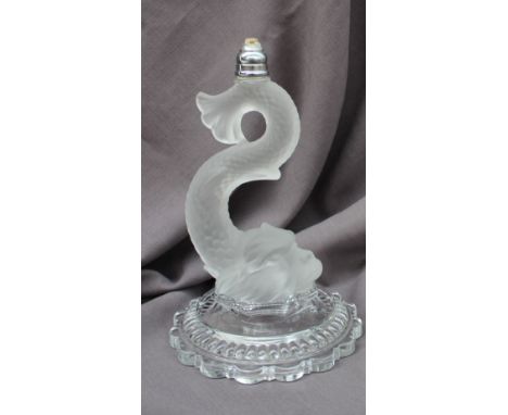 A Baccarat crystal glass lamp base in the form of a stylised dolphin, on a circular lobed base, 27.5cm high  CONDITION REPORT